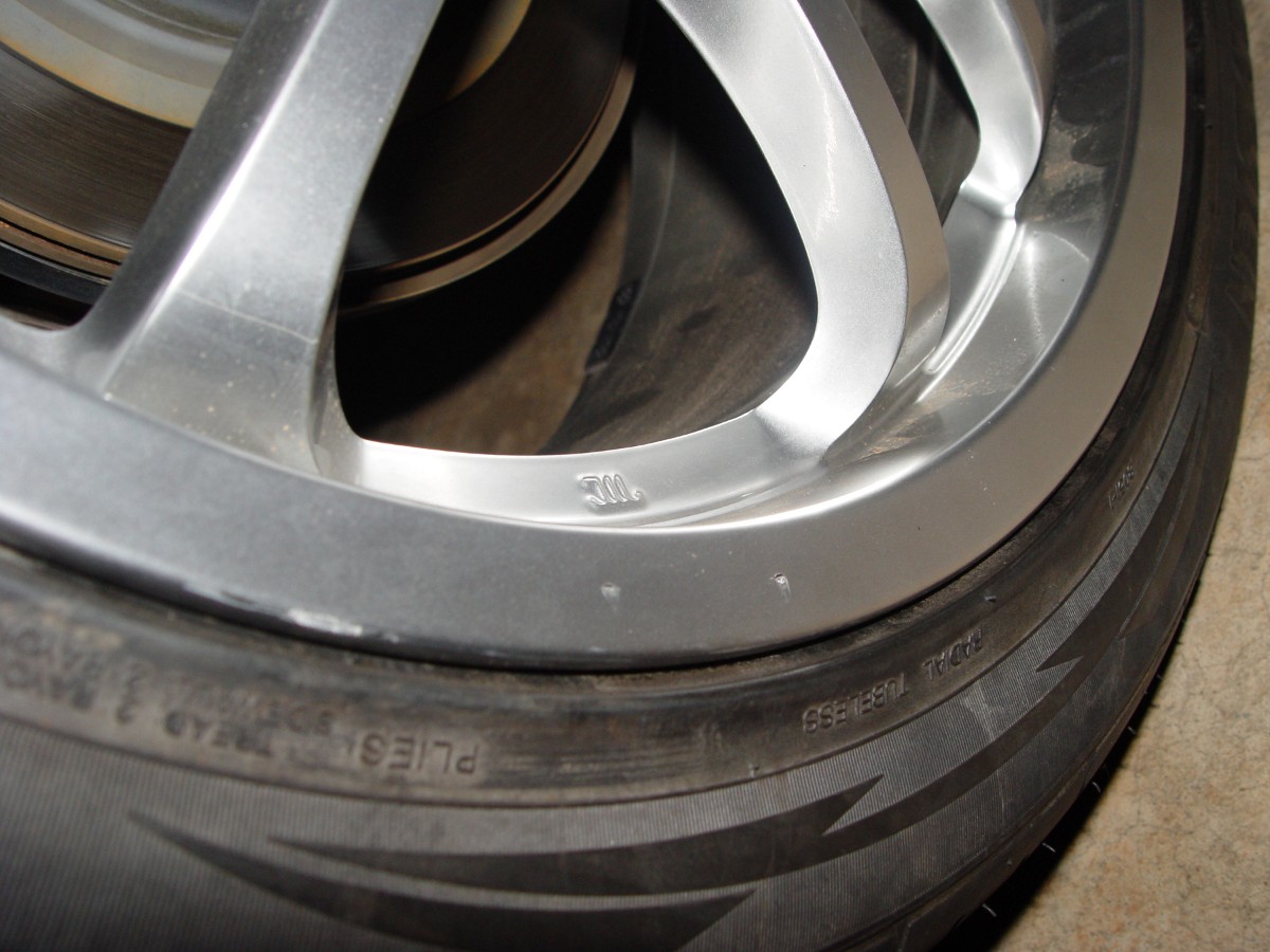 tire place gouged my rim. refinish wheel? pics of damage ...