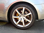 stock 18" tires front rims, and new tire rear 18" rim-rearleft1.jpg