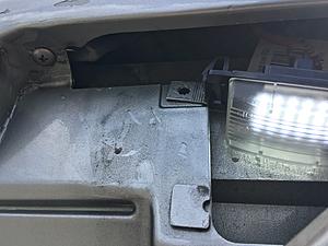 Am I missing a bracket holder for the license plate lights?-img_2844.jpg