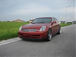 03-06 Sedan Garnet Fire Pics-new-wheel-front-driver-quarter.jpg