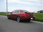03-06 Sedan Garnet Fire Pics-new-wheel-rear-driver-quarter.jpg